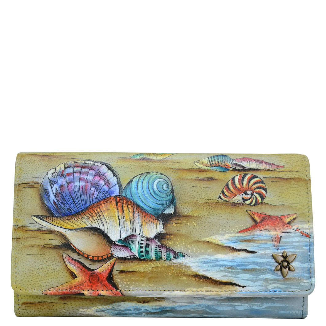 Anuschka style 1112, handpainted leather accordion flap wallet. Gift of the Sea painting in tan color. Featuring RFID blocking and many credit card slots.