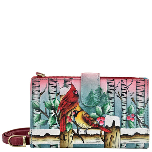 Anuschka style 1113, handpainted Cell Phone Case & Wallet. Snowy Cardinal painting in Multi color. Featuring twelve credit card holders, two ID windows, two slip-in multipurpose pockets and one full length bill pocket.