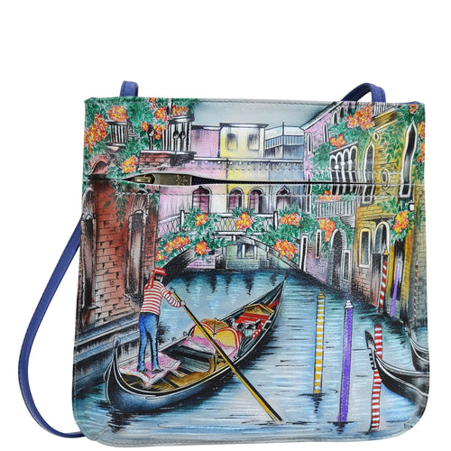 Anuschka style 452, handpainted Slim Crossbody With Front Zip. Venetian Story Painted in Multi Color. Featuring inside zippered wall pocket, cell phone pocket, Key holder, front zip pocket and rear slip pocket with removable fabric optical case.
