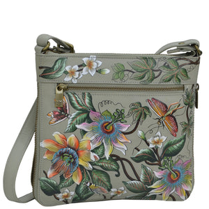Anuschka style 550, handpainted Expandable Travel Crossbody. Floral Passion painting in Green color. Fits Tablet and E-Reader.