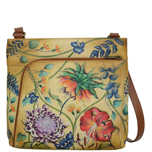 Anuschka style 651, handpainted Crossbody With Front Zip Organizer. Caribbean Garden Painted in Tan Color. Featuring front zippered RFID protected organizer chamber with gusset contains four card holder, two pen holders, one ID window and one slip in pocket.