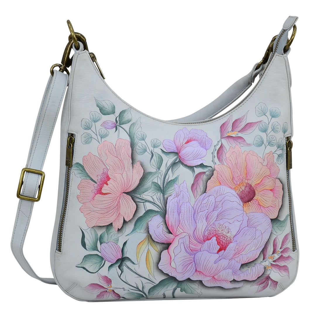 Anuschka style 662, handpainted Convertible Slim Hobo With Crossbody Strap. Bel Fiori Painted in Grey Color. Featuring inside zippered wall pocket, one open wall pocket, two multipurpose pockets with gusset and rear full length zippered pocket, slip in cell pocket.