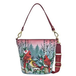 Anuschka style 699, Handpainted Tall Bucket Hobo. Snowy Cardinal painting in Multi color. Featuring Rear full length zip pocket, slip in cell pocket.